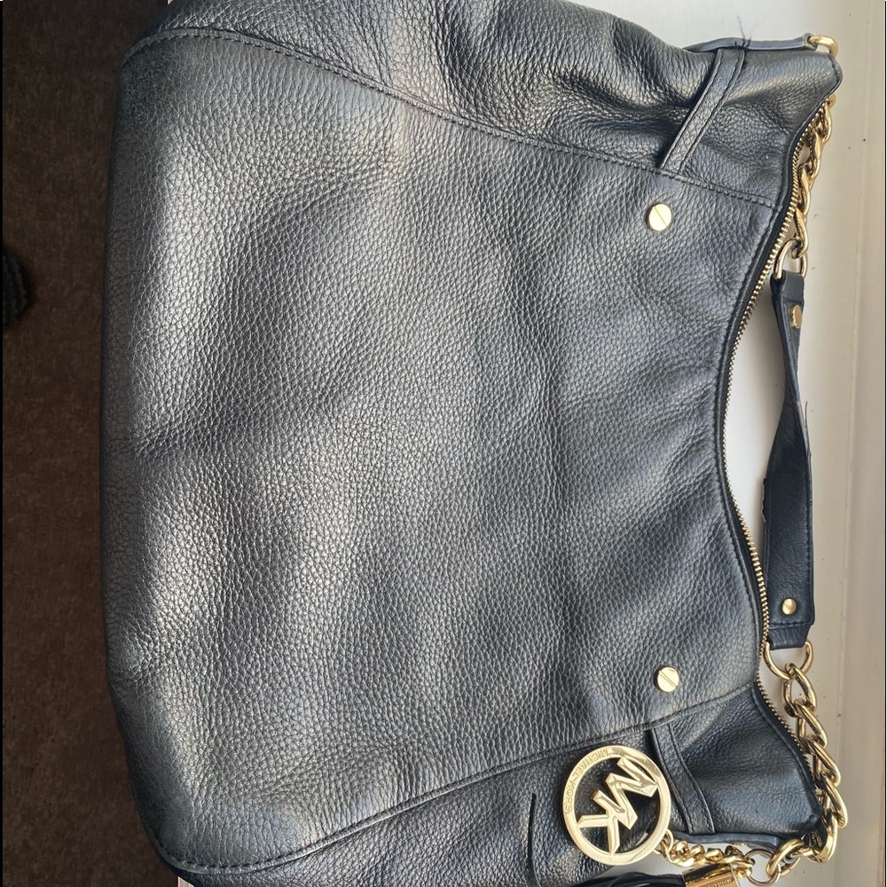 Letting go of my favorite over the shoulder bag so roomy!